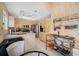 Full kitchen view, features stainless steel appliances, light wood cabinets, and kitchen island at 3042 Branch Dr, Clearwater, FL 33760