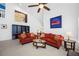 Bright living room featuring a ceiling fan, tile flooring, and vaulted ceilings at 3042 Branch Dr, Clearwater, FL 33760