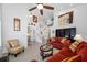 Great room with a view into the dining room, a ceiling fan, and tile flooring at 3042 Branch Dr, Clearwater, FL 33760