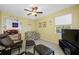 Living room with a view to outside, a ceiling fan, and tile flooring at 3042 Branch Dr, Clearwater, FL 33760