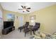 Living room with a ceiling fan, a view to outside, and tile flooring at 3042 Branch Dr, Clearwater, FL 33760