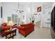Bright and airy living room boasts soaring ceilings, tile floors and an abundance of natural light at 3042 Branch Dr, Clearwater, FL 33760