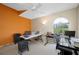 Bright office space with two workstations, colorful accent wall, and natural light at 3042 Branch Dr, Clearwater, FL 33760