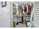 Well-organized walk-in closet with shelving, hanging space, and storage for shoes and luggage at 3042 Branch Dr, Clearwater, FL 33760