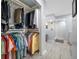 Well-organized walk-in closet with ample storage and access to the ensuite bathroom at 3042 Branch Dr, Clearwater, FL 33760