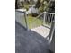 Paver stairs leading to a landscaped backyard with a white fence at 3404 S Omar Ave, Tampa, FL 33629