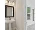 Bright half-bath with white vanity at 3404 S Omar Ave, Tampa, FL 33629
