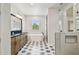 Bathroom features a soaking tub, walk-in shower, and double vanity at 3404 S Omar Ave, Tampa, FL 33629