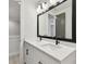 Bright bathroom featuring a double sink vanity with white countertops and modern fixtures at 3404 S Omar Ave, Tampa, FL 33629