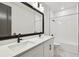 Bright bathroom featuring a double sink vanity with white countertops and modern fixtures at 3404 S Omar Ave, Tampa, FL 33629