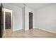 Bedroom with hardwood floors and a gray closet door at 3404 S Omar Ave, Tampa, FL 33629