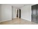 Bedroom with hardwood floors, white walls, and black door trim at 3404 S Omar Ave, Tampa, FL 33629