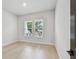 Bedroom with hardwood floors and two windows at 3404 S Omar Ave, Tampa, FL 33629