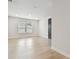 Light-filled bedroom with wood-look floors, and a neutral color scheme at 3404 S Omar Ave, Tampa, FL 33629