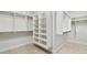 Walk in closet with adjustable shelving and light wood flooring at 3404 S Omar Ave, Tampa, FL 33629