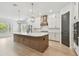 Elegant kitchen features a large island, stainless appliances, and custom cabinetry at 3404 S Omar Ave, Tampa, FL 33629
