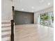 Spacious living room featuring wood-look floors and access to an outdoor patio at 3404 S Omar Ave, Tampa, FL 33629