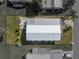 Aerial view of the home shows the roof, surrounding yard space, and patio furniture at 35925 Hermoso Ln, Zephyrhills, FL 33541