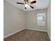 Bedroom with neutral walls, plush carpeting, and natural light at 3622 Wiregrass Rd, New Port Richey, FL 34655
