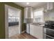 Modern kitchen design with stainless appliances and backyard view at 560 80Th N Ave, St Petersburg, FL 33702