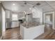 Modern kitchen features granite counters, stainless appliances, and stylish pendant lighting at 560 80Th N Ave, St Petersburg, FL 33702