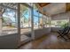 The screened in porch features tiled flooring with neighborhood views at 560 80Th N Ave, St Petersburg, FL 33702