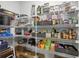 Walk-in pantry featuring wire shelving to maximize storage space, as well as tiled flooring at 5809 Silver Sun Dr, Apollo Beach, FL 33572