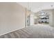 Bright living room featuring vaulted ceilings, a ceiling fan, and sliding glass doors to backyard at 6431 43Rd E Ct, Sarasota, FL 34243