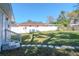 A spacious backyard features stone pavers, a white fence, and a well-maintained lawn at 7015 N Dakota Ave, Tampa, FL 33604