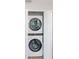 Convenient closet with a stackable washer and dryer for space-saving laundry solutions at 7015 N Dakota Ave, Tampa, FL 33604
