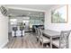 Open layout showcasing a modern kitchen, dining area, and living room for seamless entertaining and Gathering living at 7015 N Dakota Ave, Tampa, FL 33604