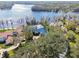 Aerial shot of lakefront home with lush landscaping and private waterfront access at 8510 Lays Cove Pl, Odessa, FL 33556