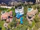 Aerial view showcases multiple houses with swimming pools and private drives at 8510 Lays Cove Pl, Odessa, FL 33556