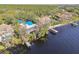 Overhead image of a house on the lake. Featuring the home's blue tile roof and access to the water at 8510 Lays Cove Pl, Odessa, FL 33556