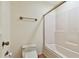 Simple bathroom featuring a toilet, a towel rack, and a shower-tub combination at 8510 Lays Cove Pl, Odessa, FL 33556