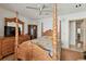 Bedroom featuring a wooden four-poster bed, matching dresser and a ceiling fan at 8510 Lays Cove Pl, Odessa, FL 33556