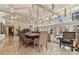 Bright dining area with floor to ceiling windows and modern decor, creating an elegant space for gatherings at 8510 Lays Cove Pl, Odessa, FL 33556