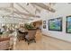 Dining room featuring an open layout, bright walls, and wooden ceiling beams, creating a modern atmosphere at 8510 Lays Cove Pl, Odessa, FL 33556