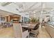 Spacious dining area with tile flooring, an open kitchen view, and stylish decor providing a bright and inviting space at 8510 Lays Cove Pl, Odessa, FL 33556