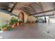Large, sheltered driveway with brick paving, potted plants, and ample parking space at 8510 Lays Cove Pl, Odessa, FL 33556