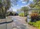 Charming home featuring a circular driveway, manicured landscaping, and a unique architectural design at 8510 Lays Cove Pl, Odessa, FL 33556