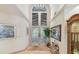 Grand foyer featuring a soaring doorway and refined decor, showcasing sophisticated design at 8510 Lays Cove Pl, Odessa, FL 33556