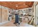 Inviting home office with a treadmill, built-in bookshelves, and a wooden ceiling at 8510 Lays Cove Pl, Odessa, FL 33556