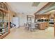 Eat-in kitchen with tile flooring, wood cabinets, glass-front display cabinet, and modern appliances at 8510 Lays Cove Pl, Odessa, FL 33556