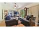 Spacious living area featuring large windows, comfortable seating, and plenty of natural light at 8510 Lays Cove Pl, Odessa, FL 33556