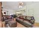 Inviting living room with comfortable leather furniture and neutral decor, perfect for relaxation at 8510 Lays Cove Pl, Odessa, FL 33556