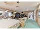 Expansive main bedroom features a sitting area with a large television and an ensuite bathroom with a tub at 8510 Lays Cove Pl, Odessa, FL 33556