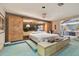 Main bedroom with built-in closets and shelving, vanity area, and plush carpet at 8510 Lays Cove Pl, Odessa, FL 33556