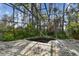 View of the vacant indoor pool with a tropical garden located within a large metal and glass atrium at 8510 Lays Cove Pl, Odessa, FL 33556