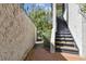 Outdoor stairway leading to the upper level, surrounded by lush landscaping at 8510 Lays Cove Pl, Odessa, FL 33556